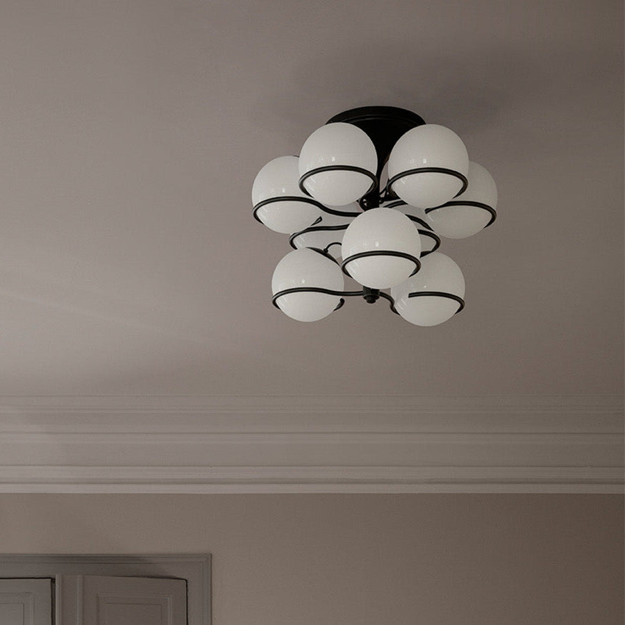 Astep Model 2042/9 Ceiling Lamp featuring nine opaline glass spheres on a refined brass frame, delivering soft illumination with timeless elegance.