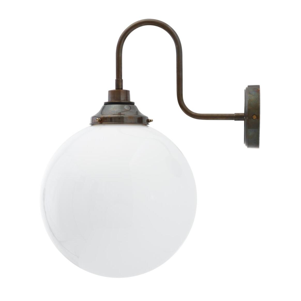 Wall-mounted light fixture with a spherical glass shade on a white background