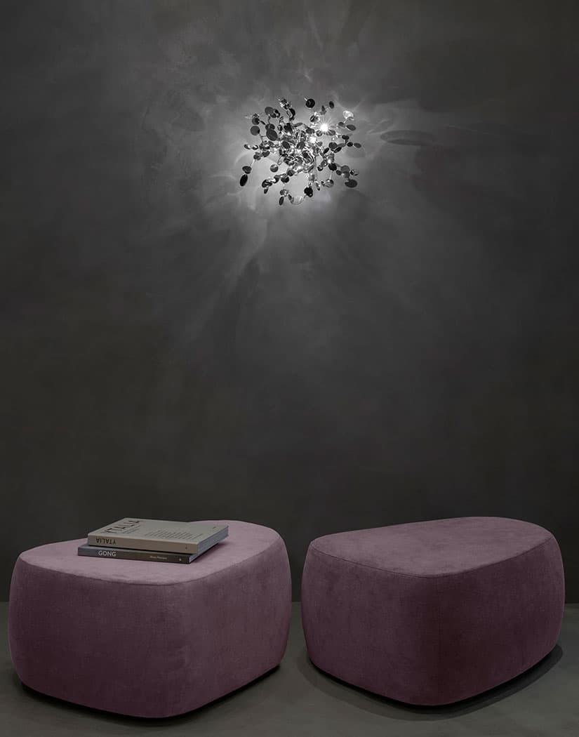 Luxury Italian wall light—Terzani Argent featuring reflective sculptural metal elements