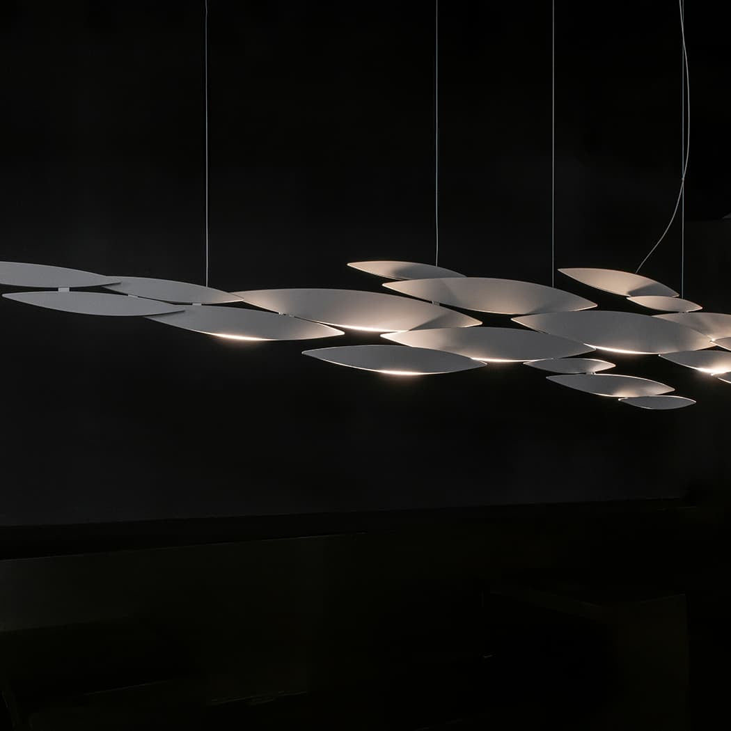 Luxury Italian pendant light—Terzani I Lucci Argentati featuring shimmering linear forms