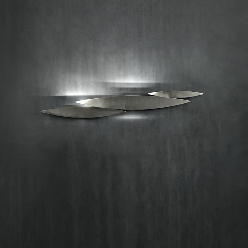 Contemporary lighting design—Terzani I Lucci Argentati casting reflective ambient glow.