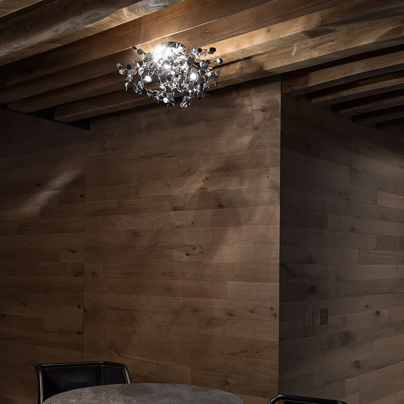 Luxury Italian ceiling light—Terzani Argent with sculptural metallic design.