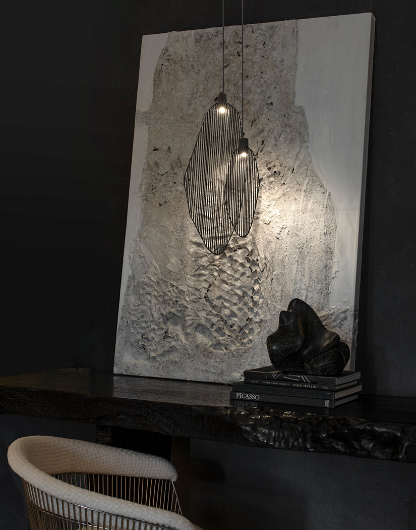 Artistic harp-inspired pendant light from Terzani featuring elegant curved metal elements.