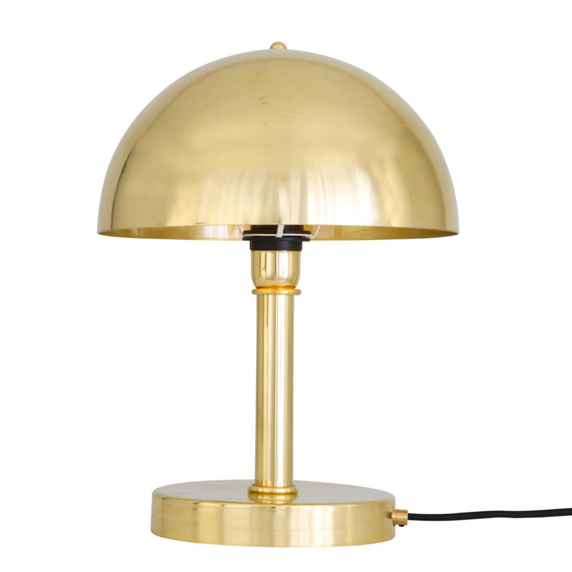 Gold table lamp on a white background