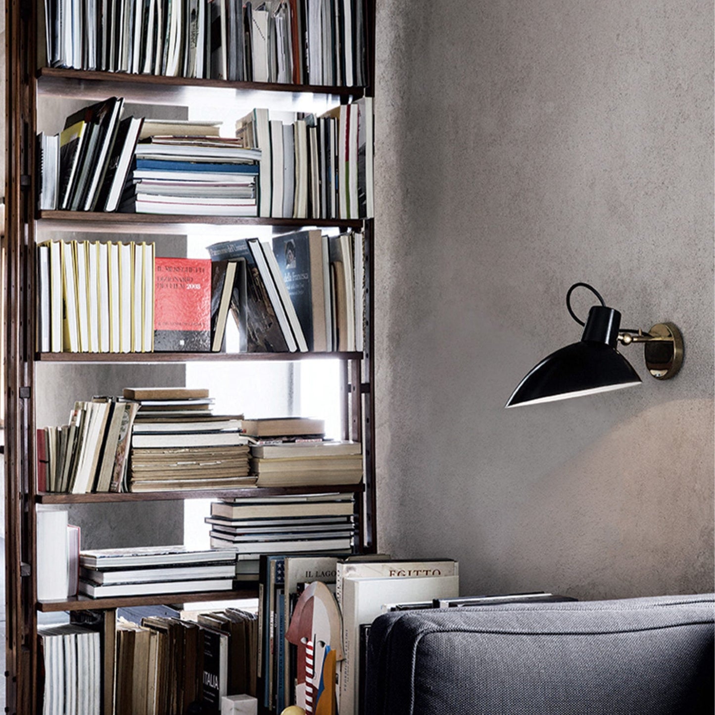 Astep VV Cinquanta Wall Lamp featuring a single adjustable aluminum reflector on a brass arm, showcasing elegant mid-century modern design.