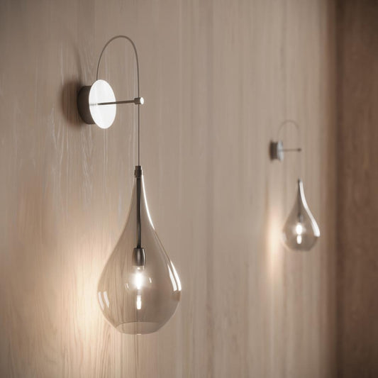 Contemporary wall lamp—LACRIMA© by Cangini & Tucci with refined teardrop silhouette.