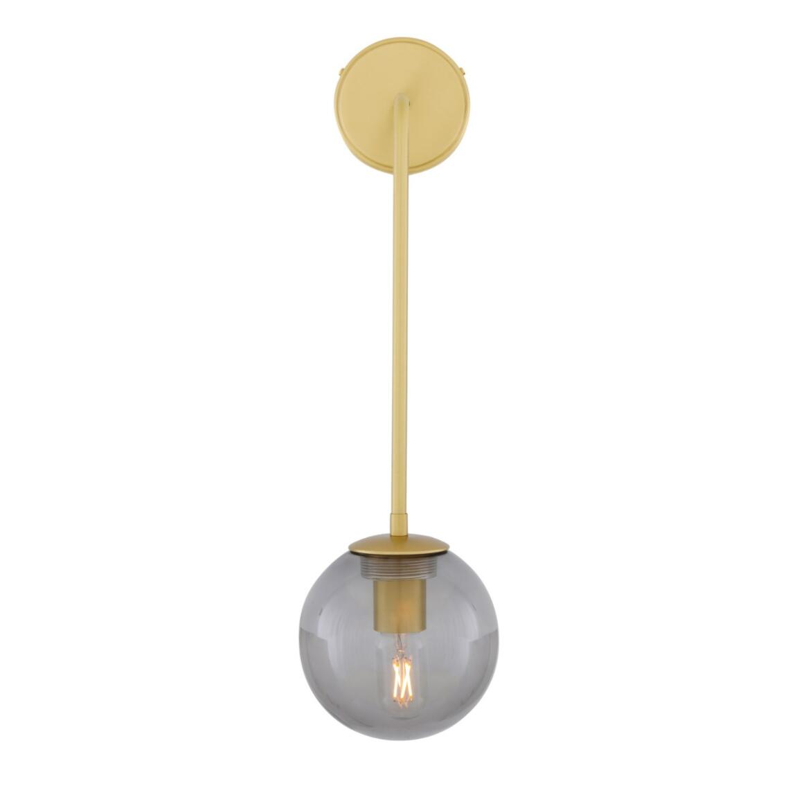 Wall-mounted light fixture with gold finish and smoked glass shade on a white background