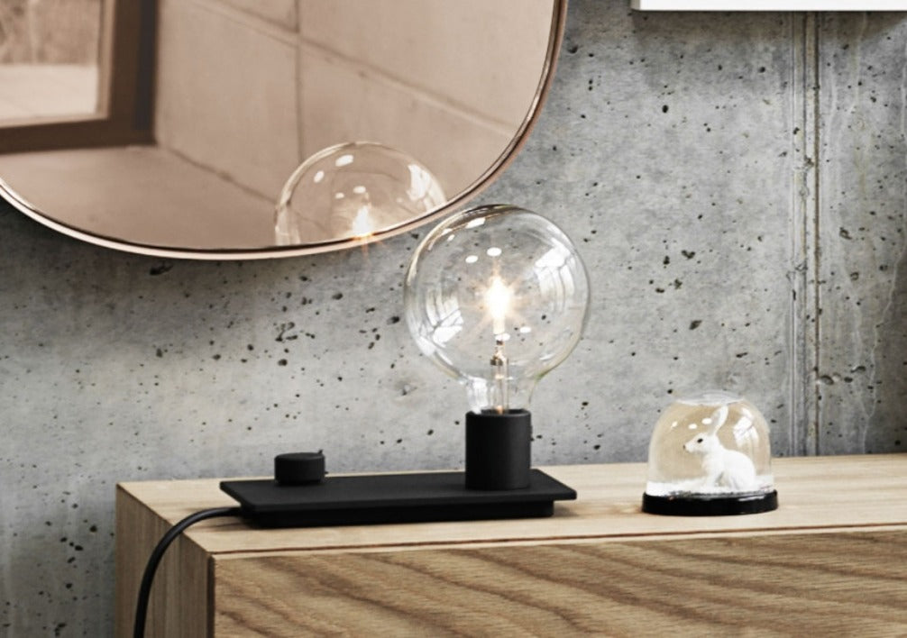 The Control Table Lamp places the iconic E27 bulb in a modern context.  With the user being able to alter the volume of light emitted according to their preferences through the playful turn of a dial, the Control Table Lamp combines industrial design with Scandinavian values.